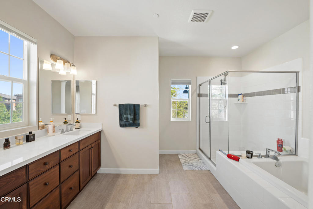 1655 Range Road Oxnard, CA 93036 - Photo 24 of 33 a spacious bathroom with double vanity and a mirror