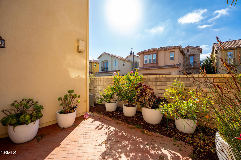 1655 Range Road Oxnard, CA 93036 - Photo 25 of 33 a view of a balcony with chair and potted plants