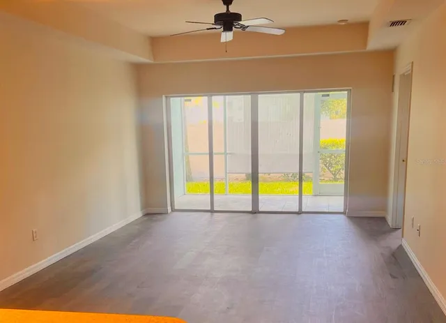 a view of an empty room with a window