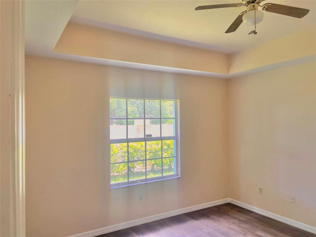 5771 Sabal Trace Drive, Unit 102 B5771 North Port, FL 34287 - Photo 15 of 37 a view of an empty room with a window