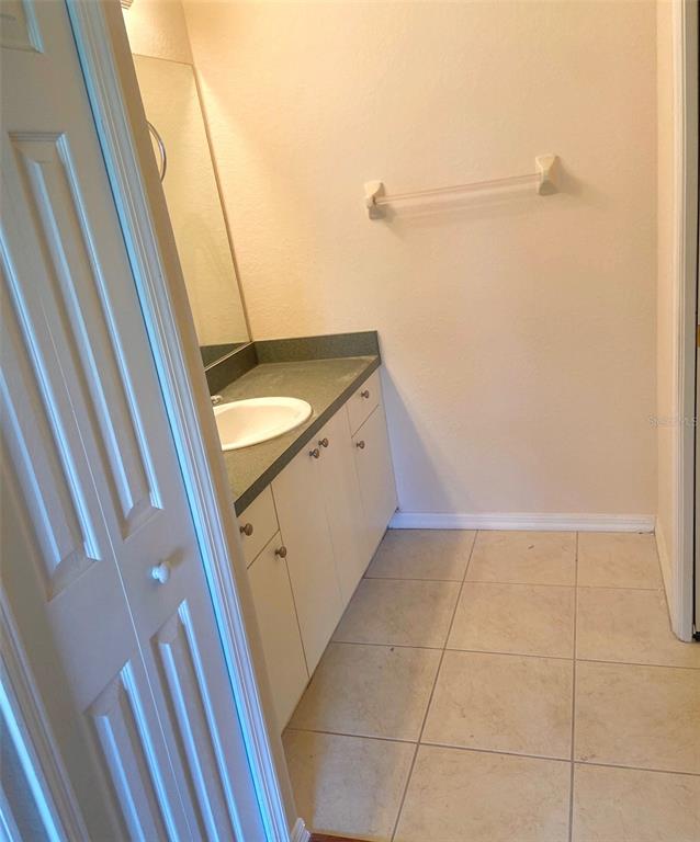 5771 Sabal Trace Drive, Unit 102 B5771 North Port, FL 34287 - Photo 19 of 37 a bathroom with a sink a toilet and a shower
