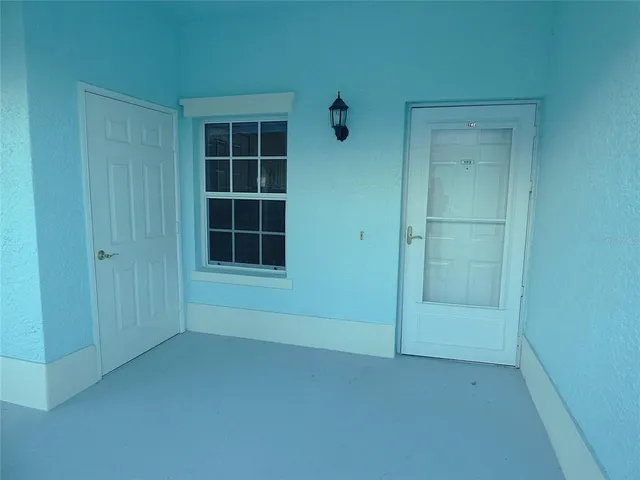 a view of empty room with windows