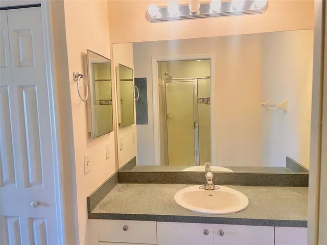 a bathroom with a sink and a mirror