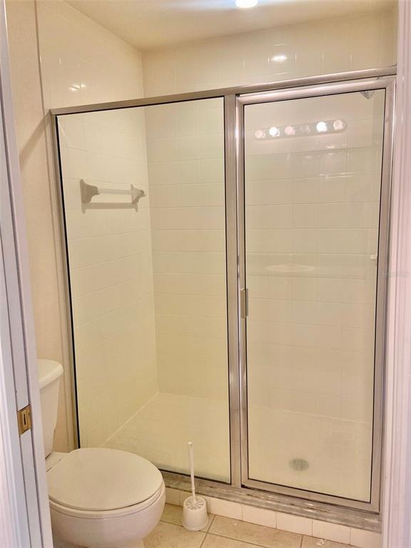 5771 Sabal Trace Drive, Unit 102 B5771 North Port, FL 34287 - Photo 23 of 37 a bathroom with a glass shower door