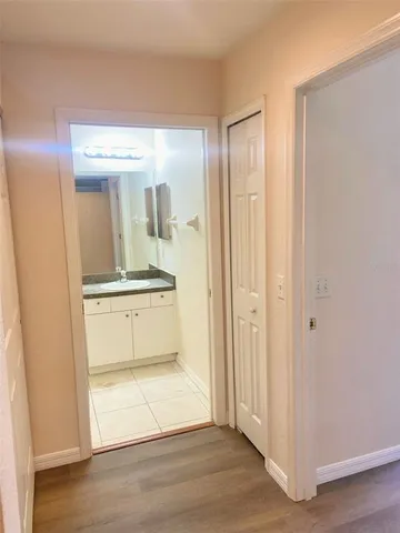 a view of a bathroom with mirror