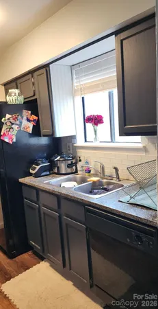a bathroom with a sink vanity and mirror
