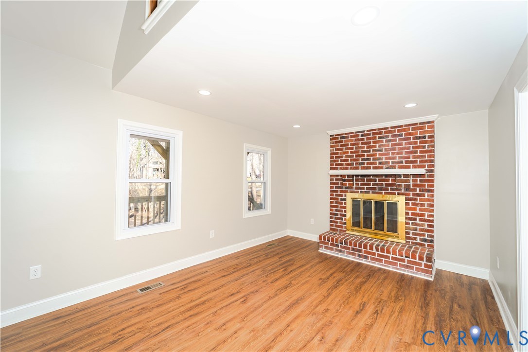 3025 Maplevale Road Chester, VA 23831 - Photo 4 of 14 Brick-clad fireplace featuring a brass firebox and