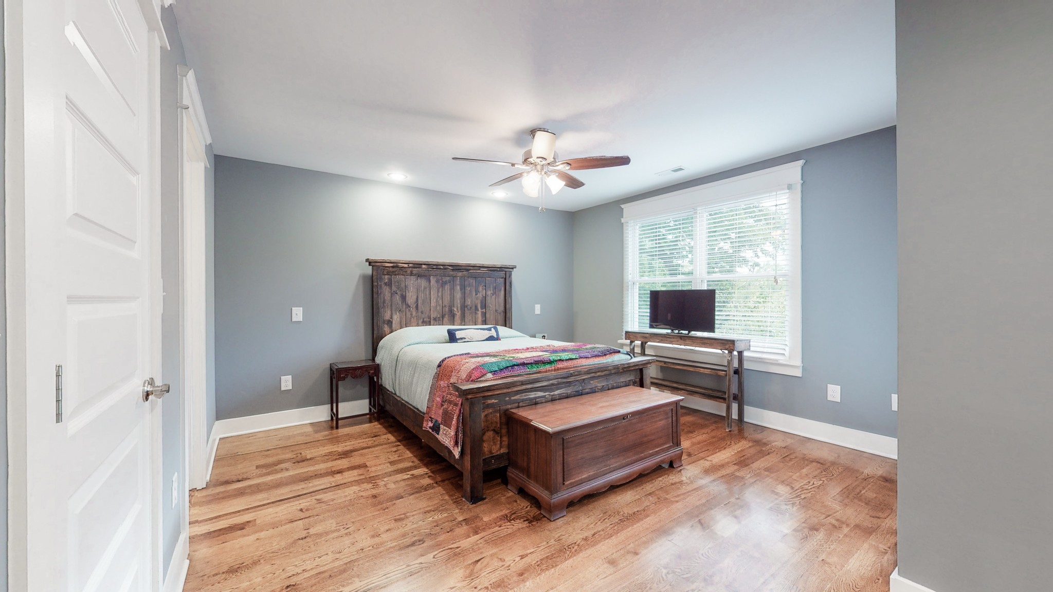 2007 Overby Road, Unit A Nashville, TN 37207 - Photo 19 of 29 a bedroom with a bed and a chandelier