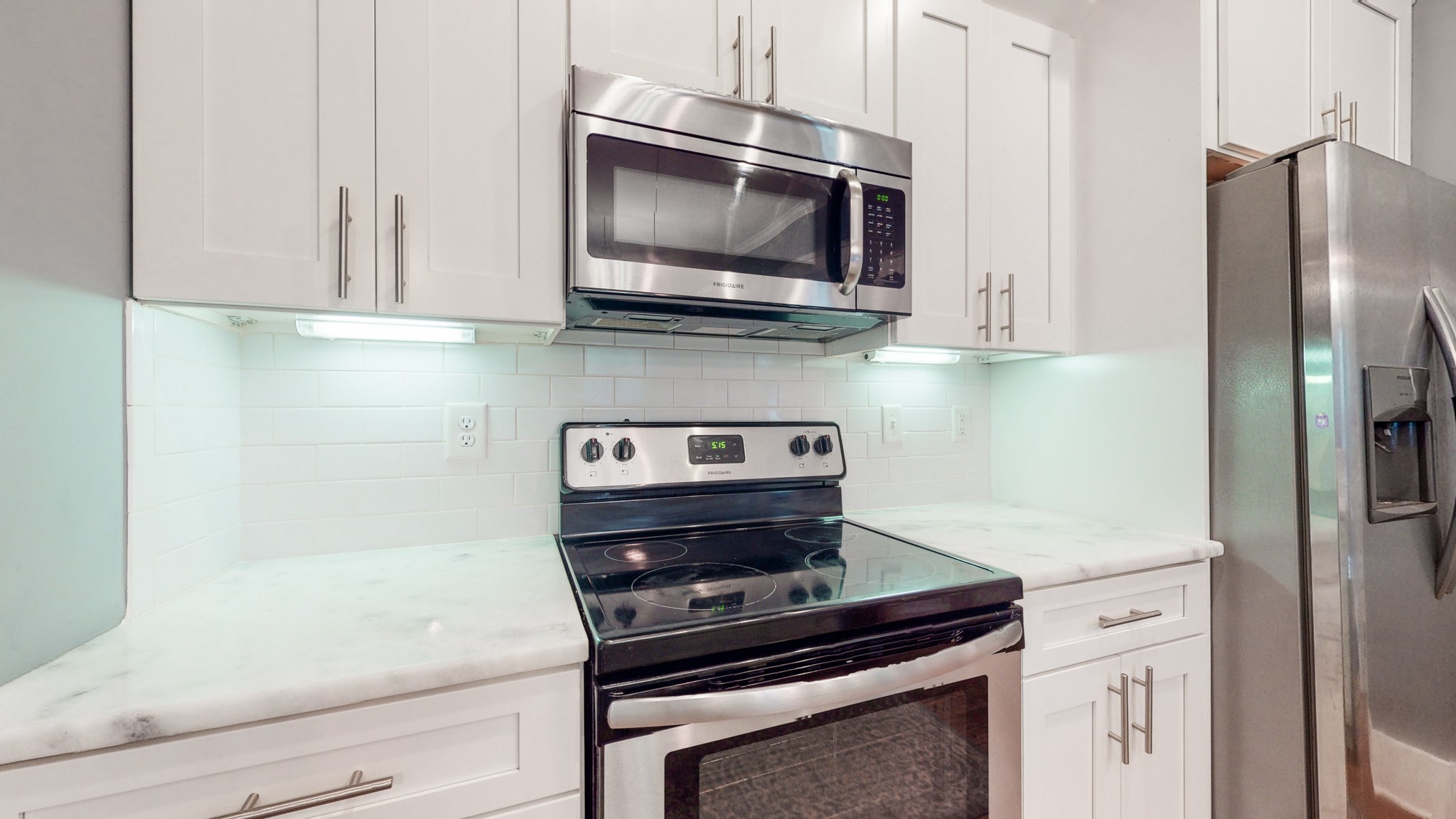 2007 Overby Road, Unit A Nashville, TN 37207 - Photo 9 of 29 a kitchen with a stove and a microwave