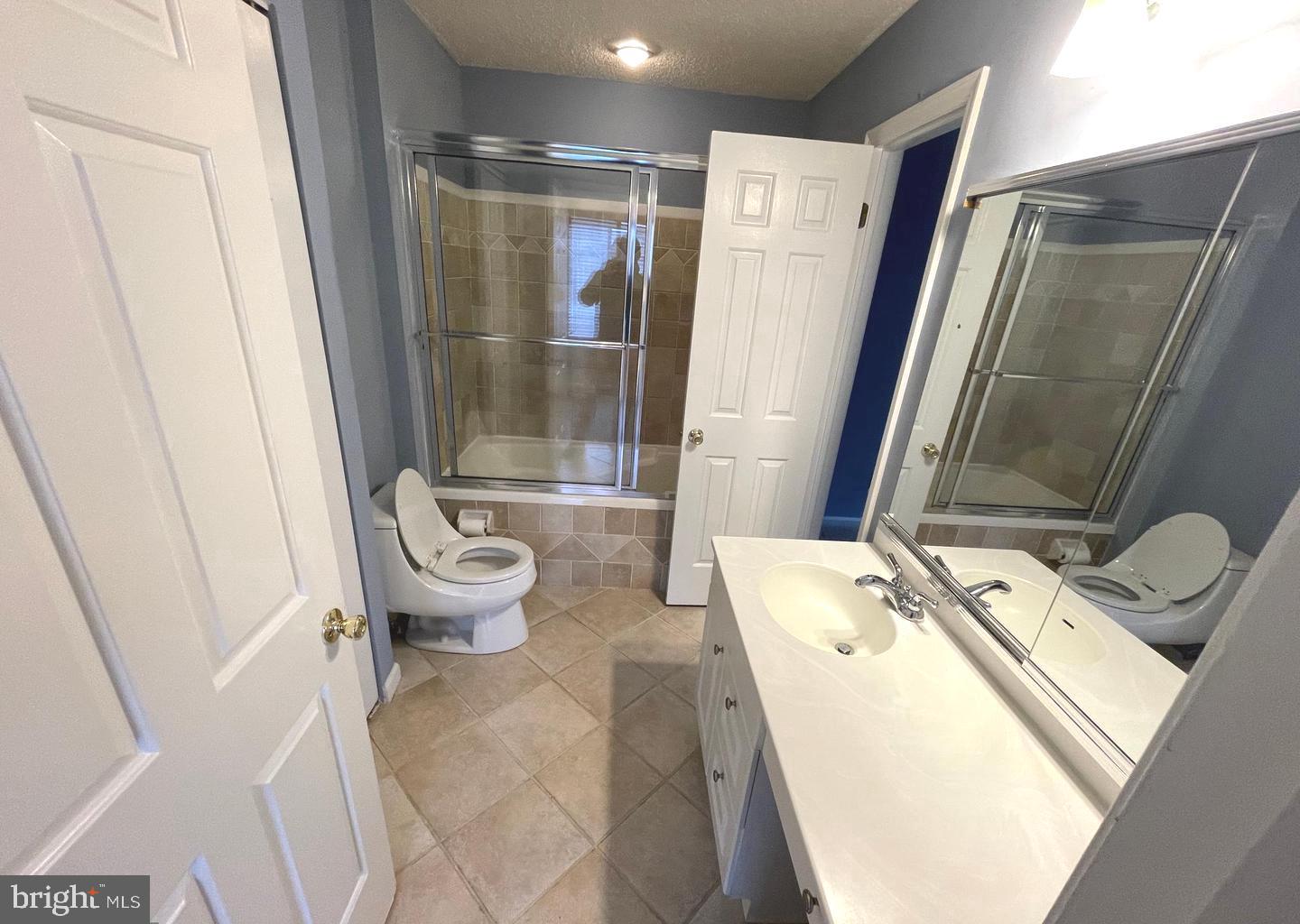 214 Carriage Court, Unit 214 Chesterbrook, PA 19087 - Photo 17 of 41 a bathroom with a sink toilet and shower