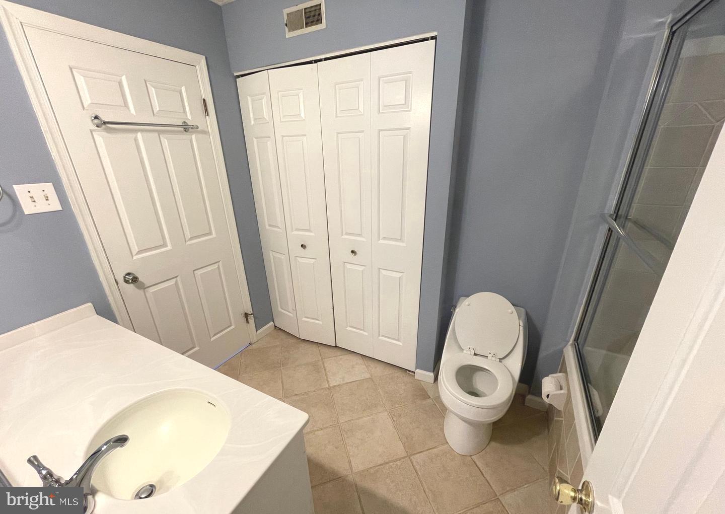 214 Carriage Court, Unit 214 Chesterbrook, PA 19087 - Photo 22 of 41 a bathroom with a sink and a mirror