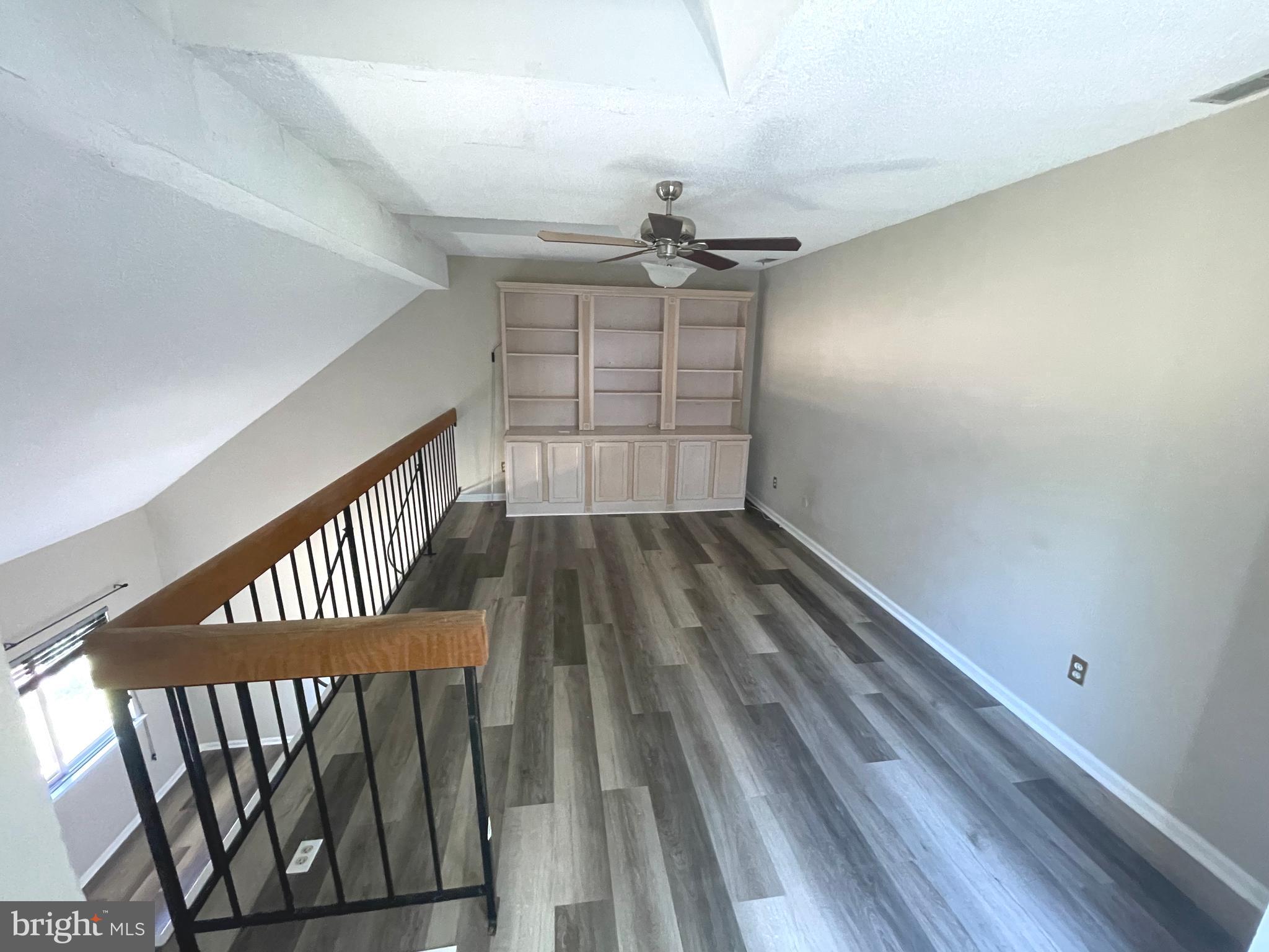 214 Carriage Court, Unit 214 Chesterbrook, PA 19087 - Photo 33 of 41 wooden floor in a hall with a window