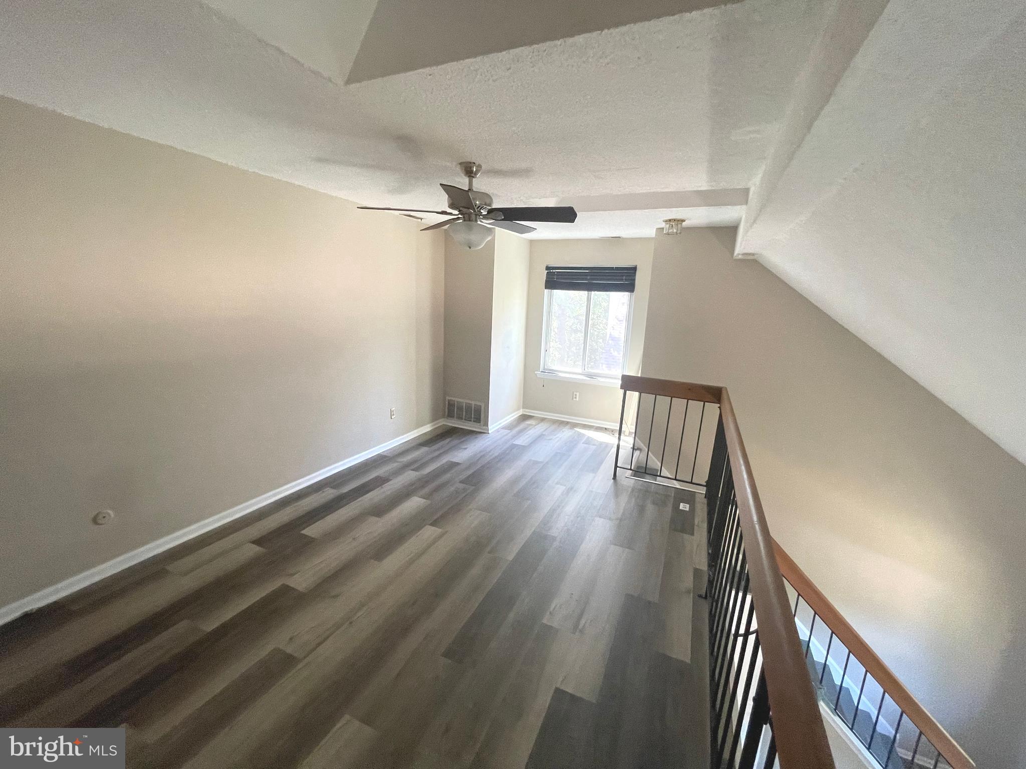 214 Carriage Court, Unit 214 Chesterbrook, PA 19087 - Photo 36 of 41 a view of empty room with wooden floor