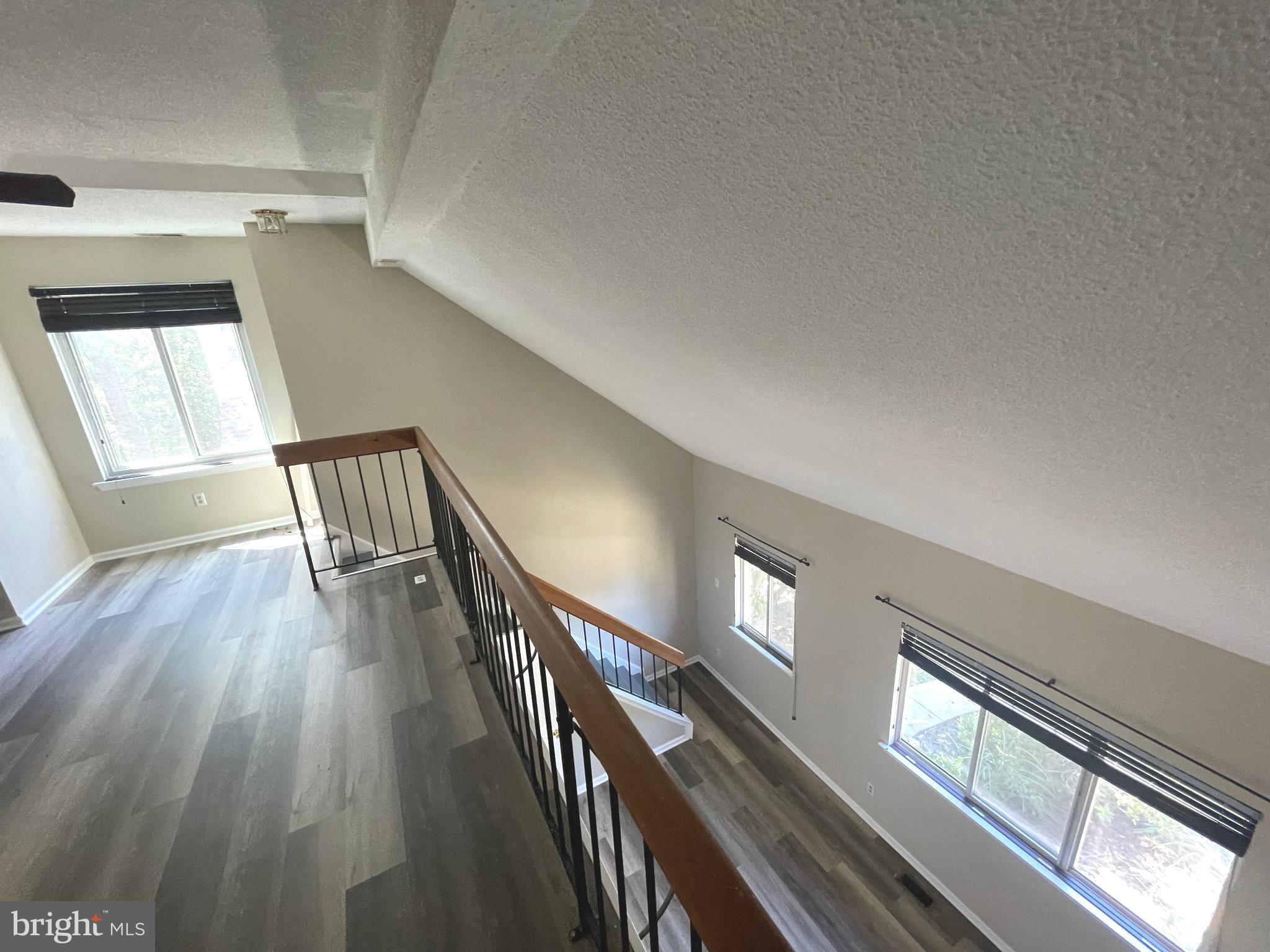 214 Carriage Court, Unit 214 Chesterbrook, PA 19087 - Photo 38 of 41 a view of gallery with wooden floor