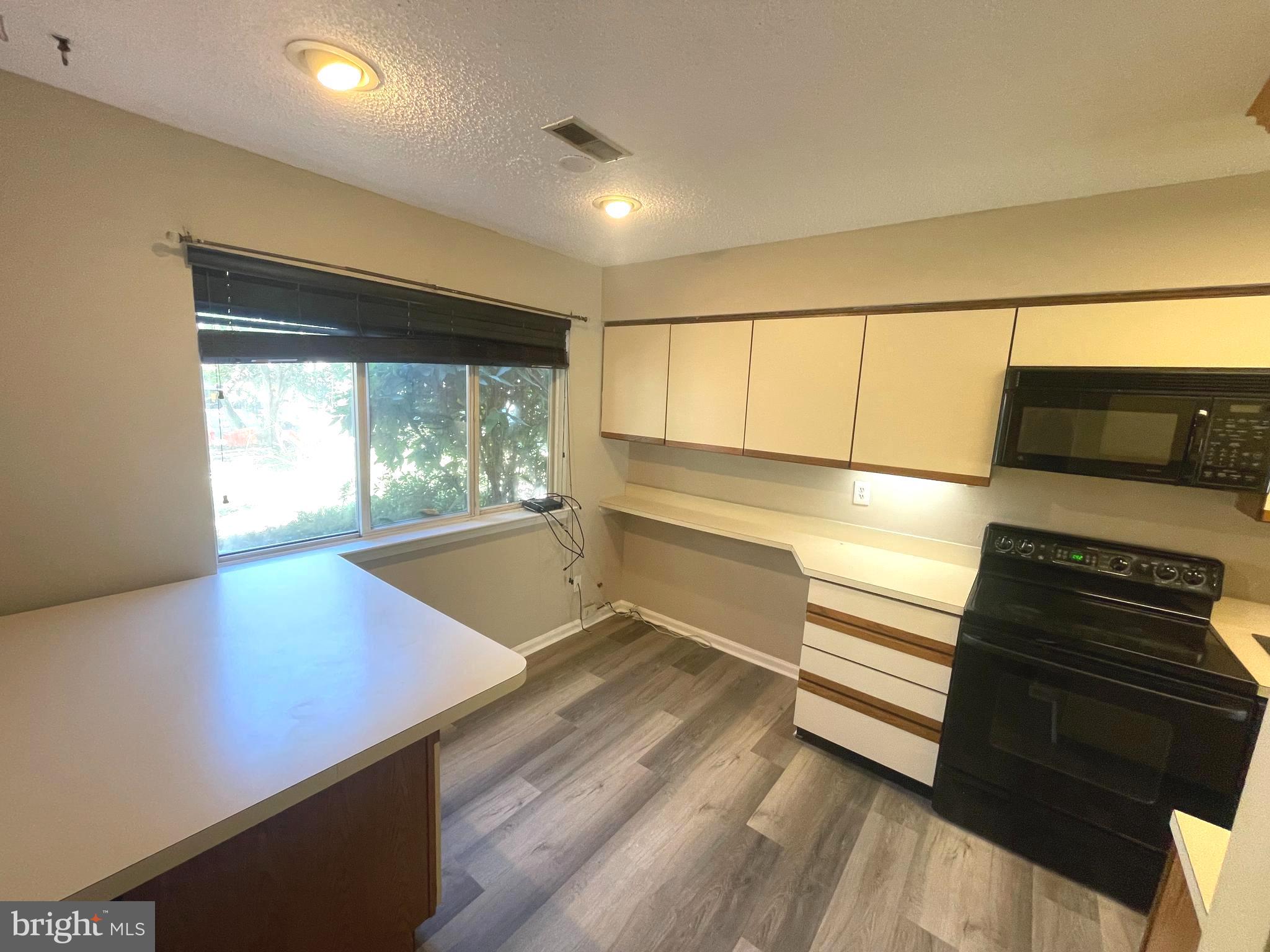 214 Carriage Court, Unit 214 Chesterbrook, PA 19087 - Photo 5 of 41 a view of an empty room with a window