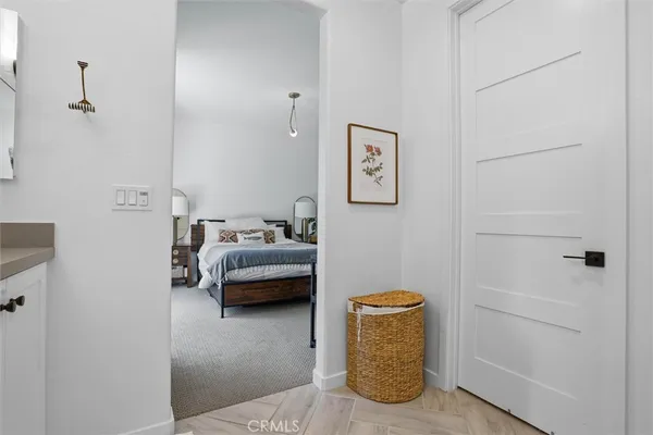 a bedroom with a bed and a couch