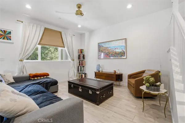 a bedroom with furniture and a window