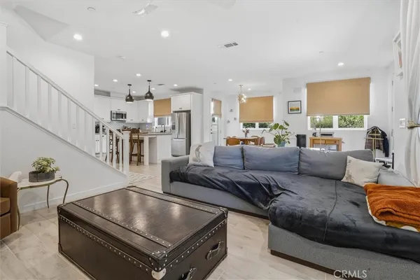 a living room with furniture and a table