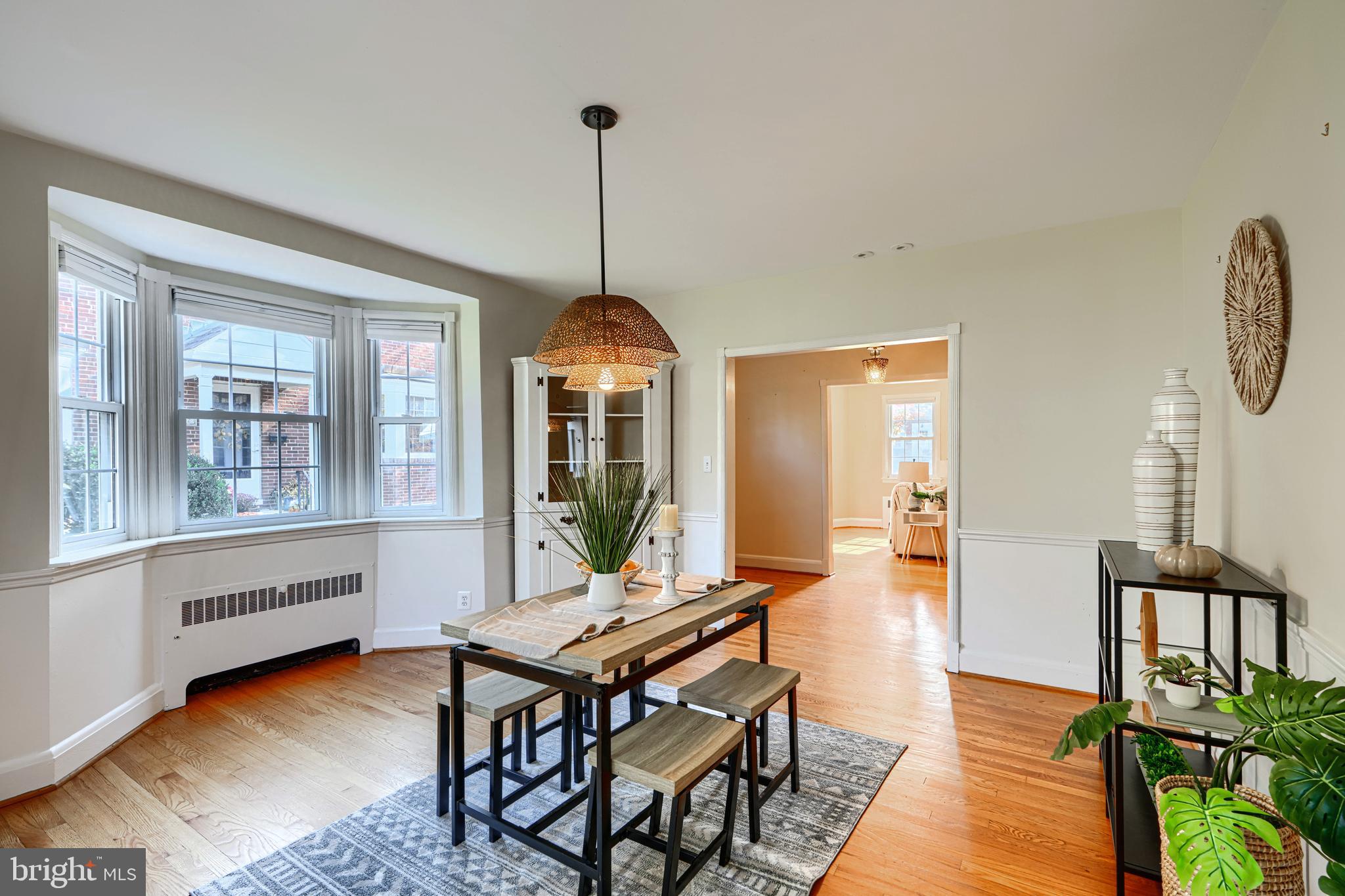100 Dunkirk Road Baltimore, MD 21212 - Photo 14 of 65 a dining room with furniture a chandelier and wooden floor