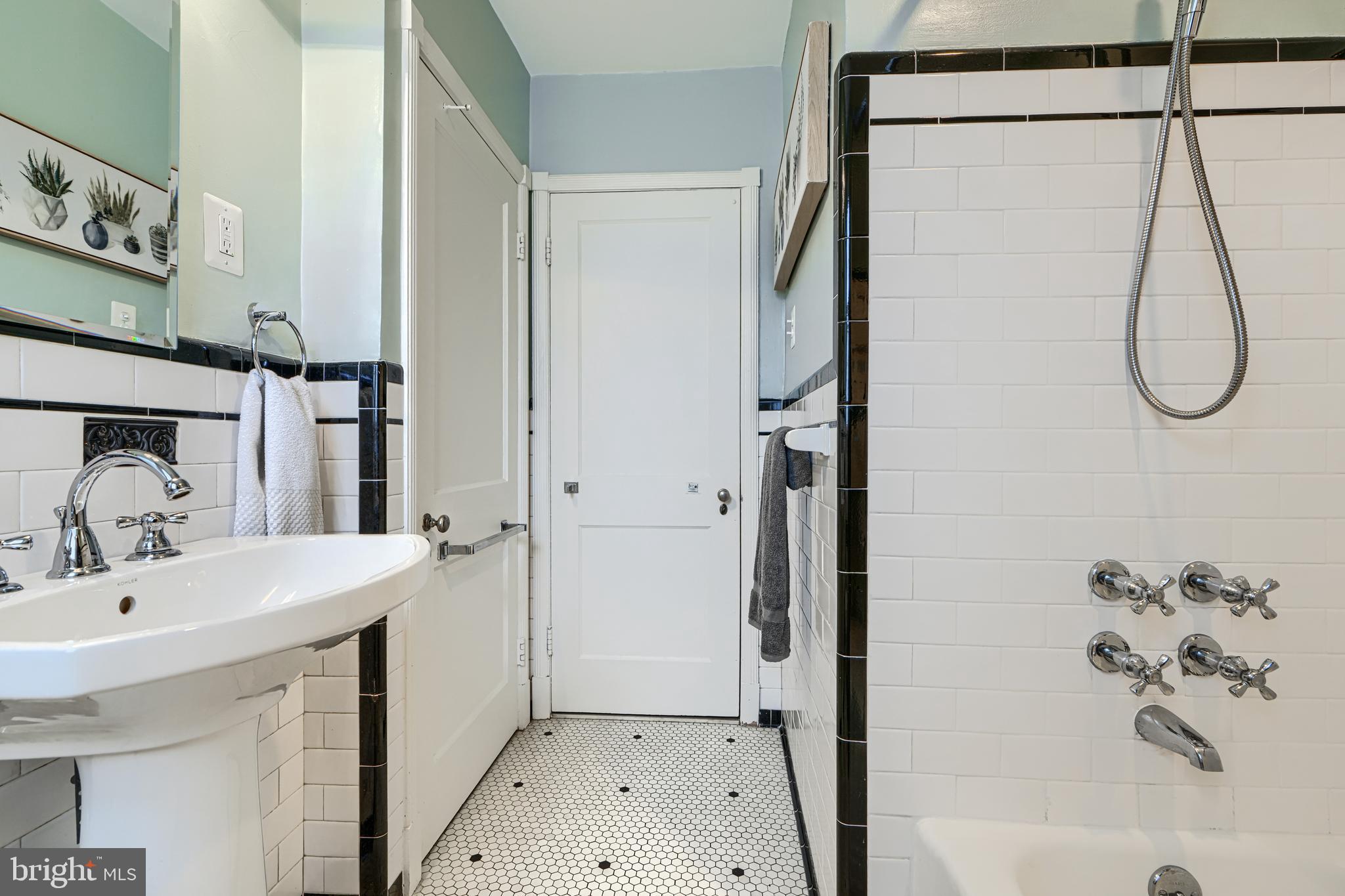 100 Dunkirk Road Baltimore, MD 21212 - Photo 25 of 65 a bathroom with a sink and a bathtub