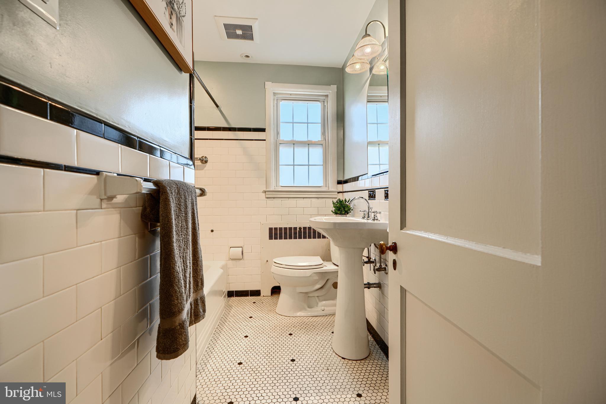 100 Dunkirk Road Baltimore, MD 21212 - Photo 26 of 65 a bathroom with a sink toilet and shower