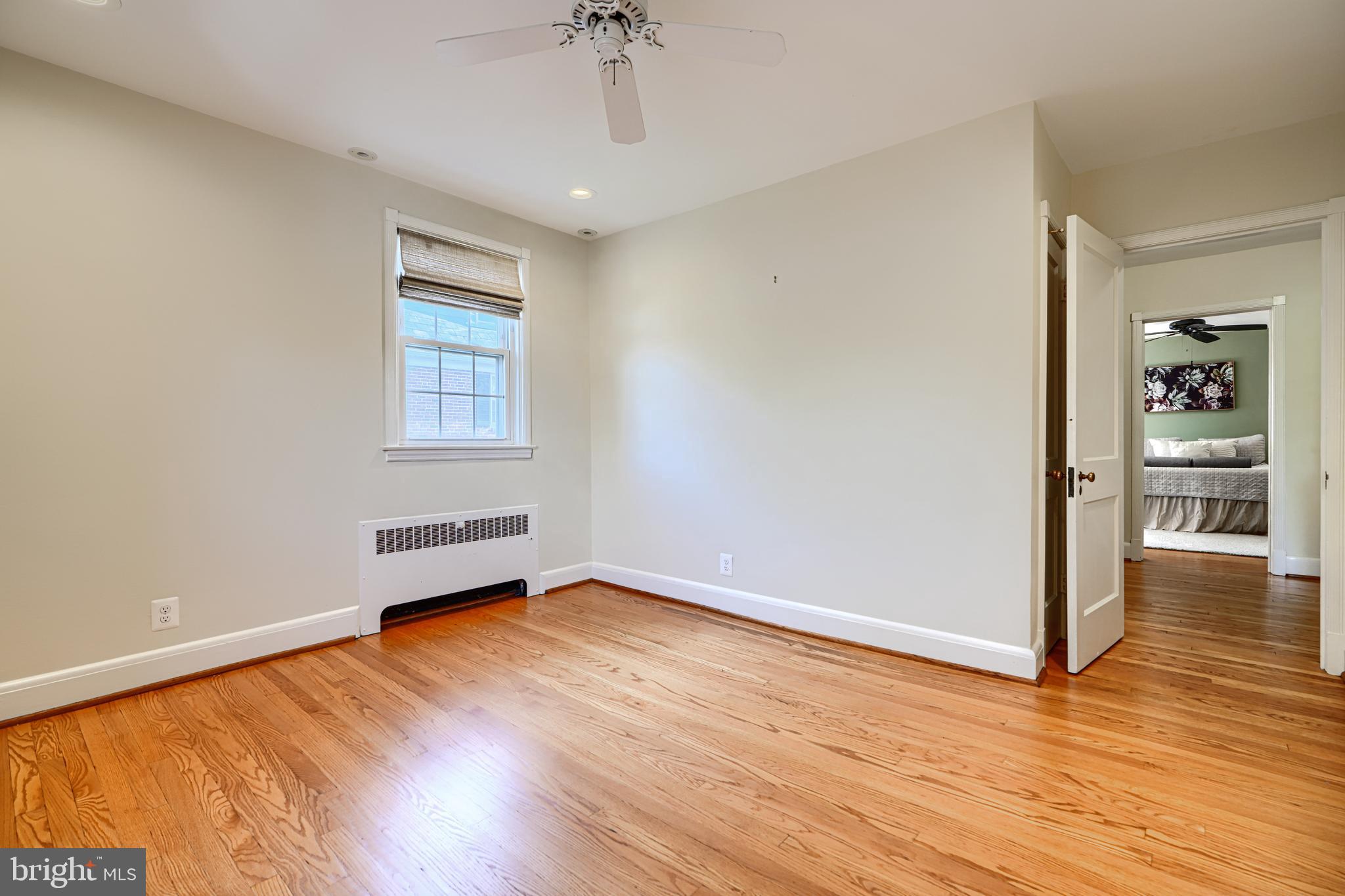 100 Dunkirk Road Baltimore, MD 21212 - Photo 27 of 65 wooden floor in an empty room with a window