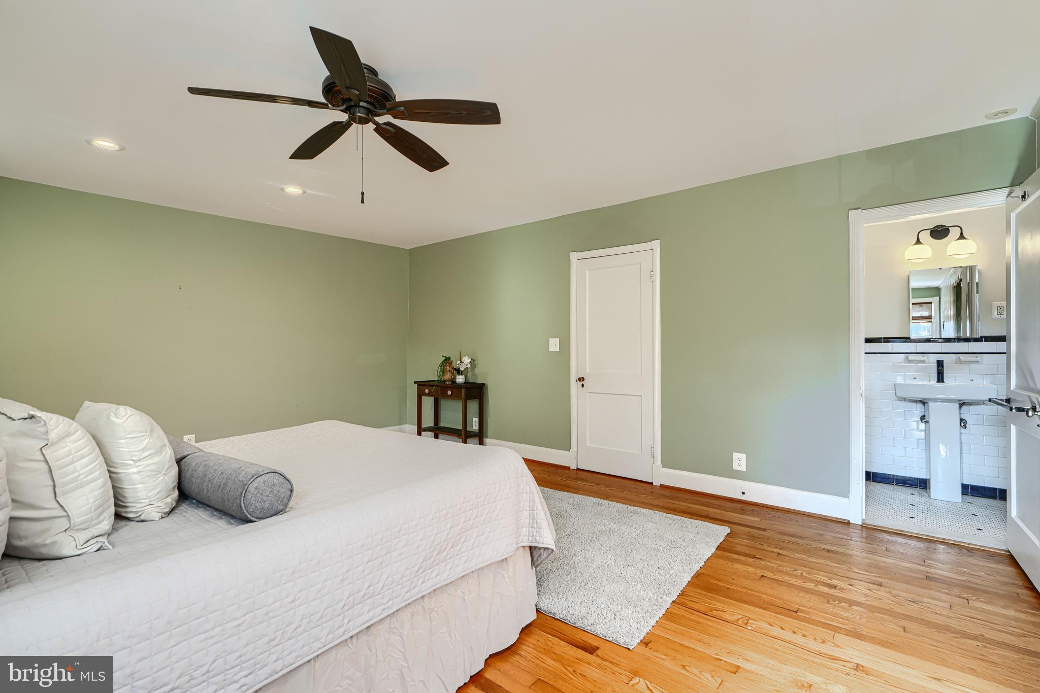 100 Dunkirk Road Baltimore, MD 21212 - Photo 30 of 65 a bedroom with a bed and a chandelier