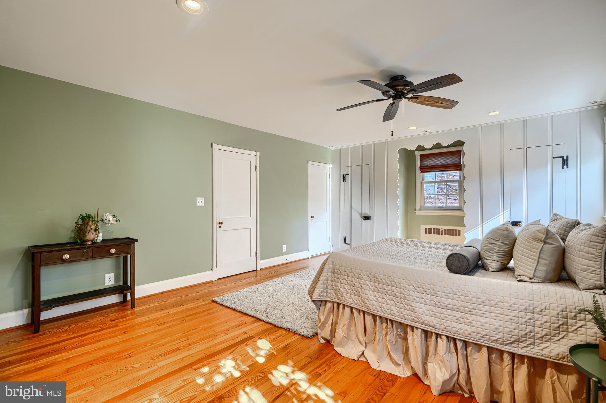 100 Dunkirk Road Baltimore, MD 21212 - Photo 33 of 65 a bedroom with a bed and wooden floor