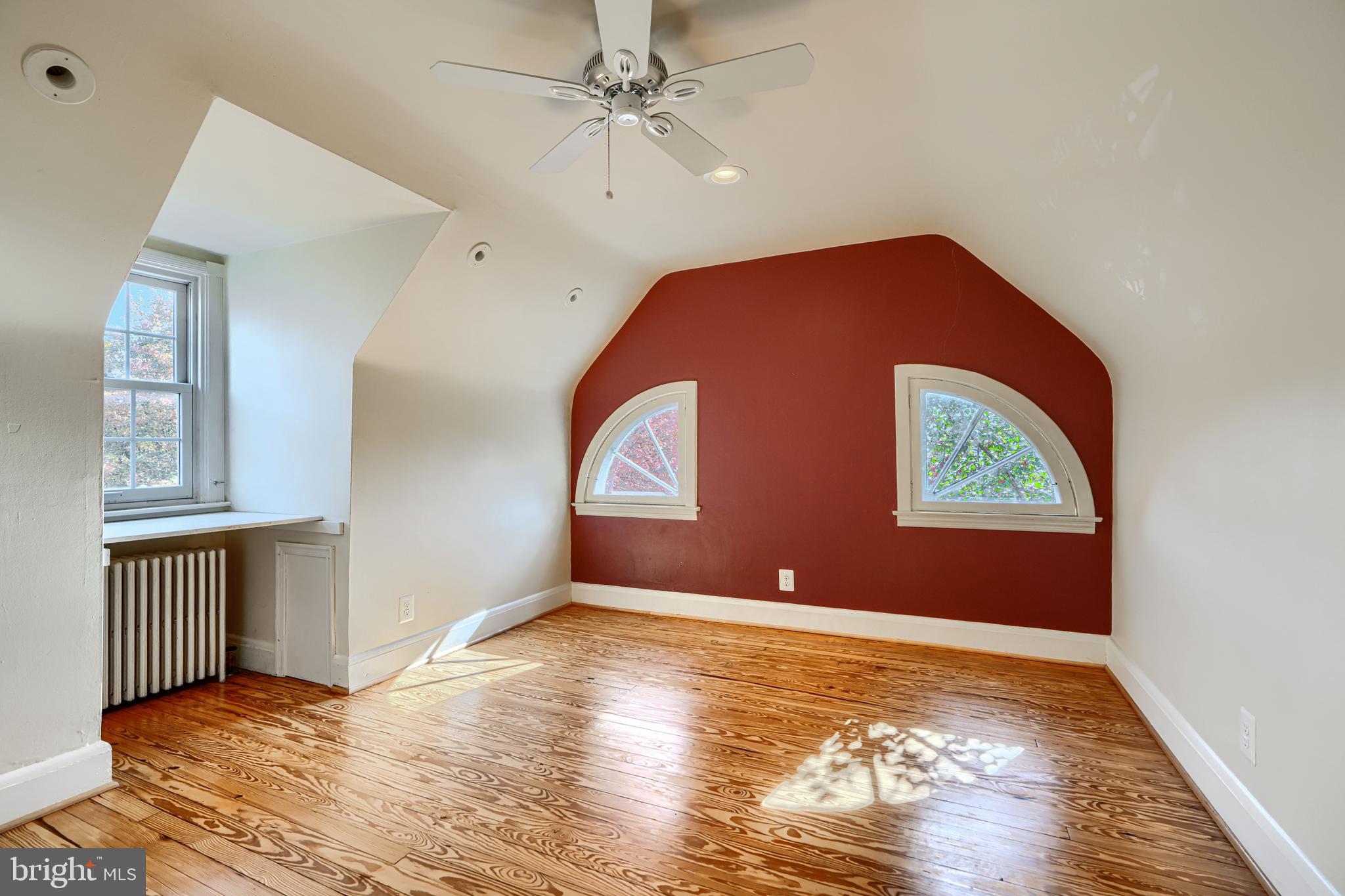 100 Dunkirk Road Baltimore, MD 21212 - Photo 37 of 65 a view of an empty room with wooden floor and a window