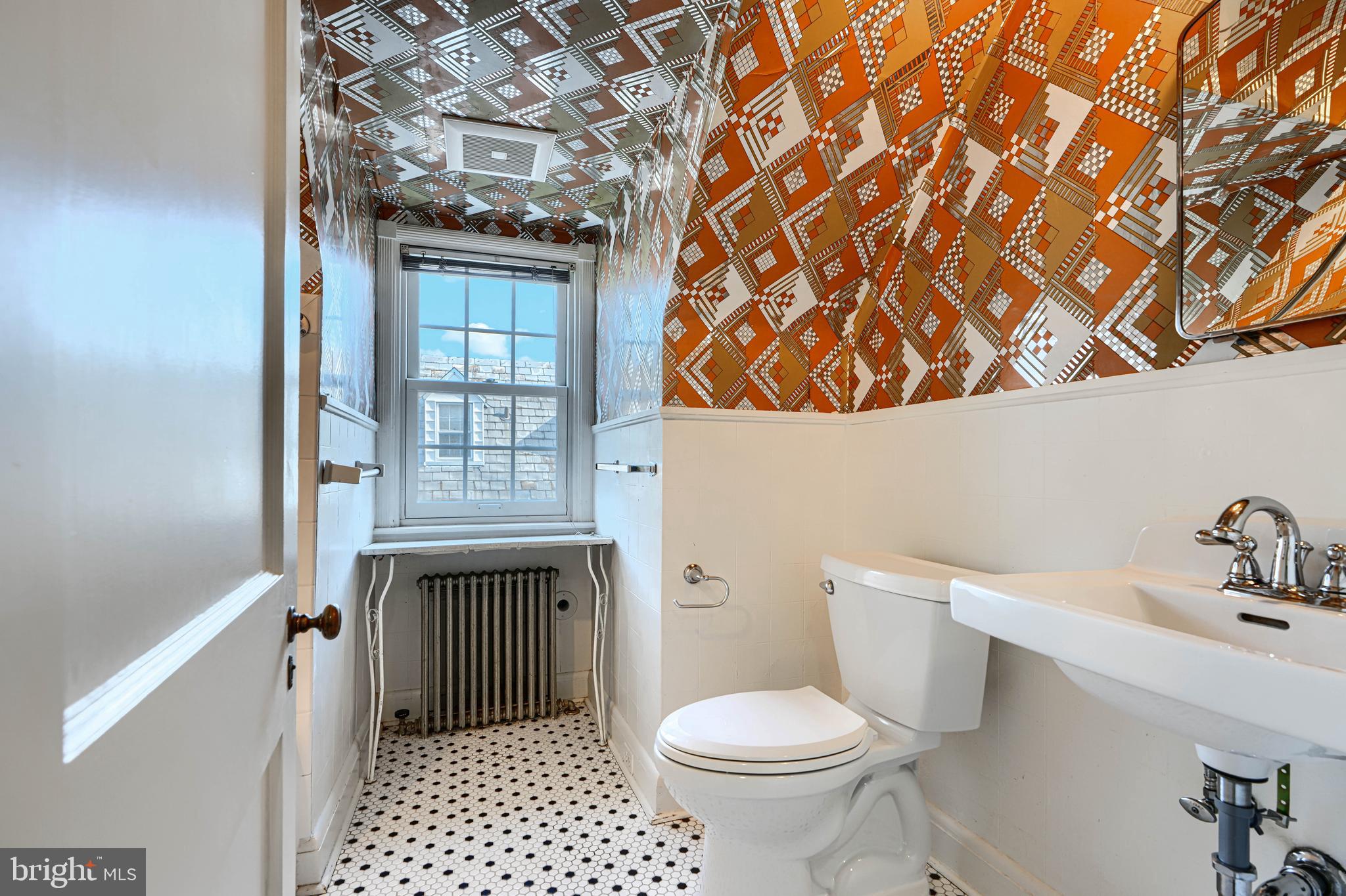 100 Dunkirk Road Baltimore, MD 21212 - Photo 39 of 65 a bathroom with a sink a toilet and shower