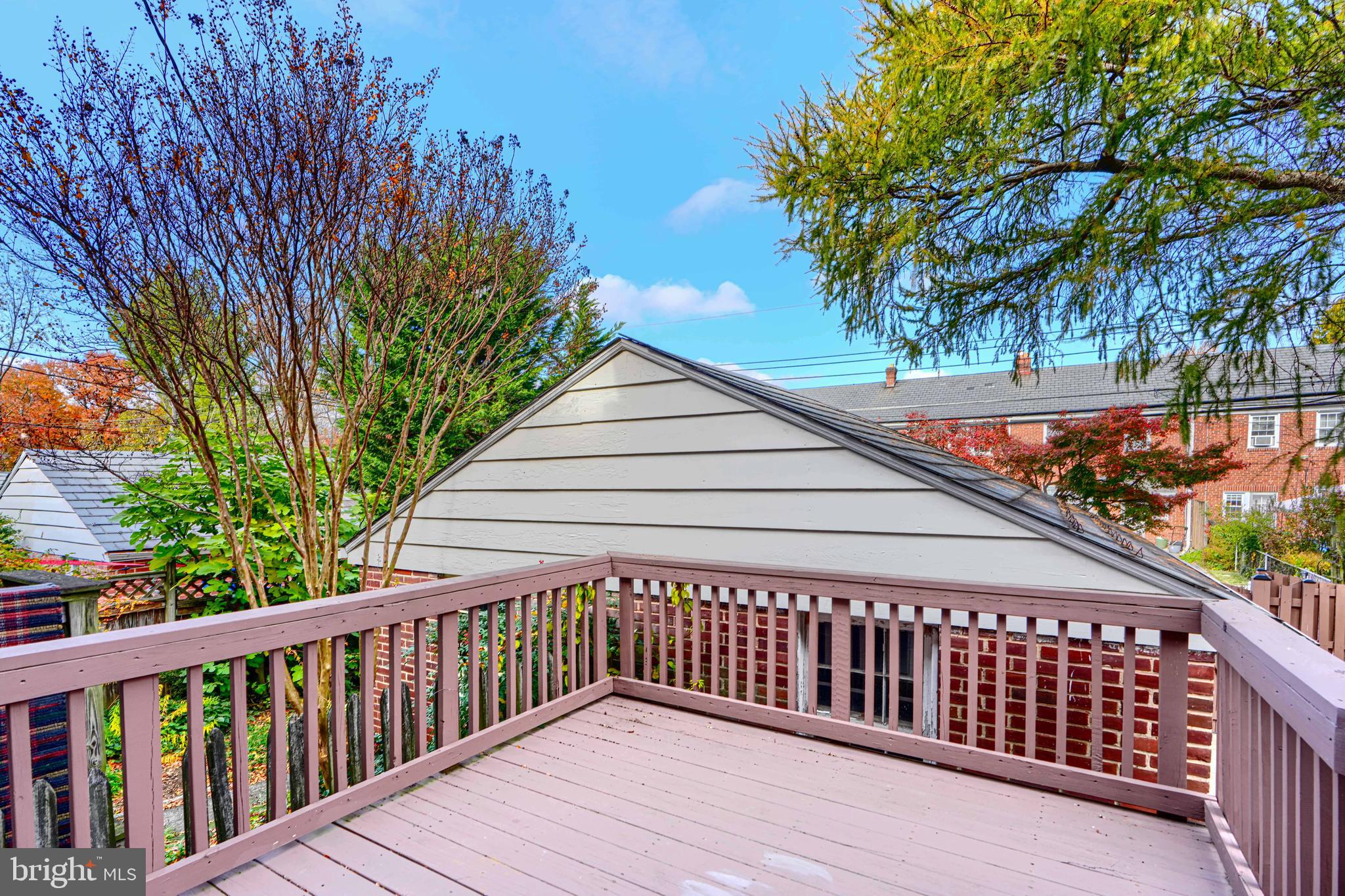 100 Dunkirk Road Baltimore, MD 21212 - Photo 55 of 65 a balcony with wooden floor and trees in the back