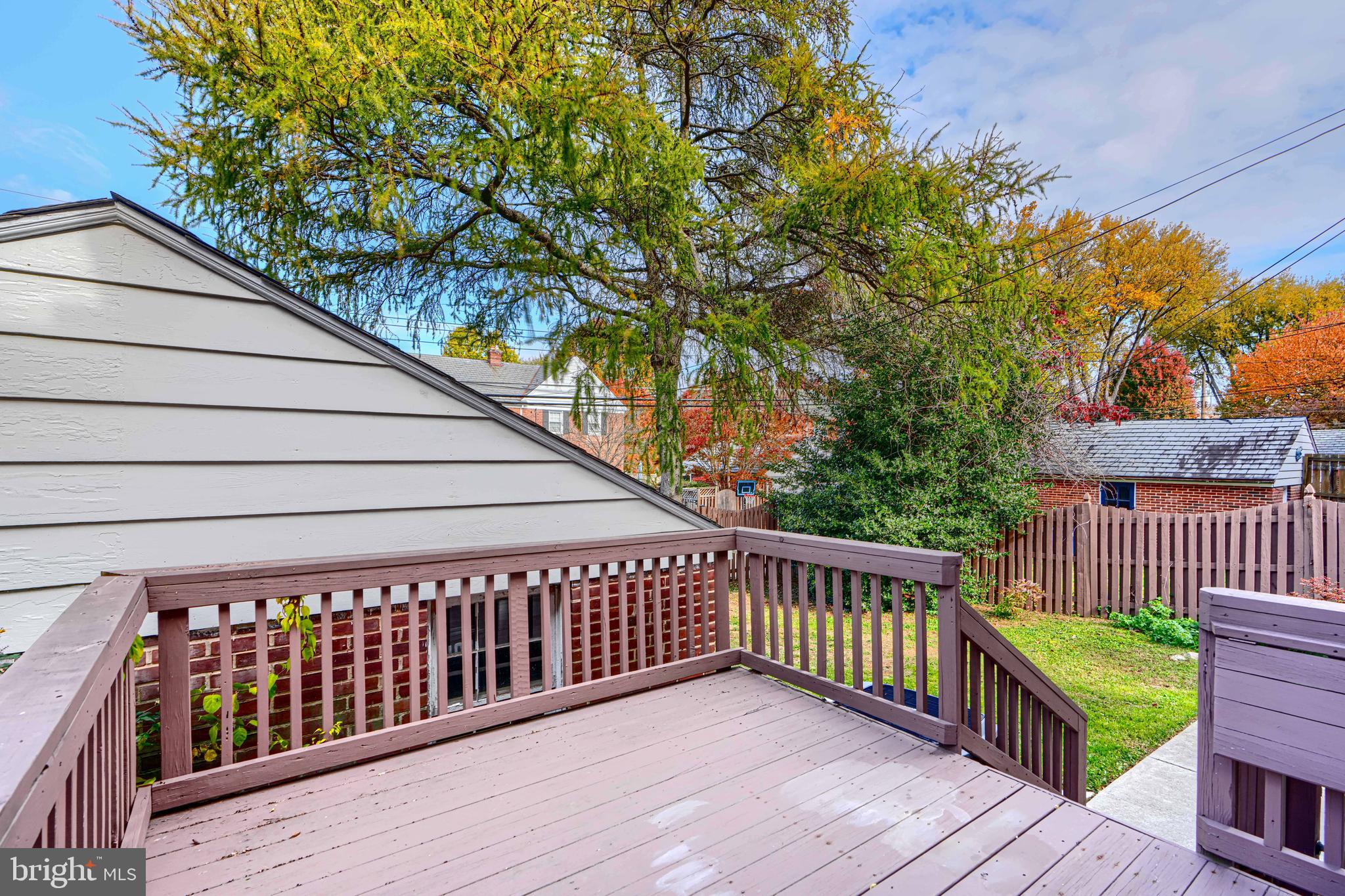 100 Dunkirk Road Baltimore, MD 21212 - Photo 57 of 65 a balcony with wooden floor and fence and a bench