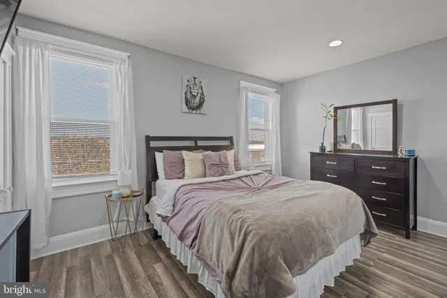 a bedroom with a bed and a dresser