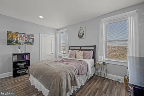 a bedroom with a bed and a bookshelf