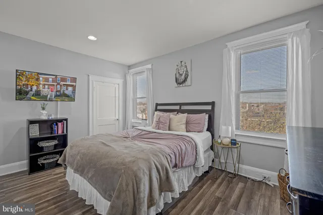 a bedroom with a bed and a bookshelf