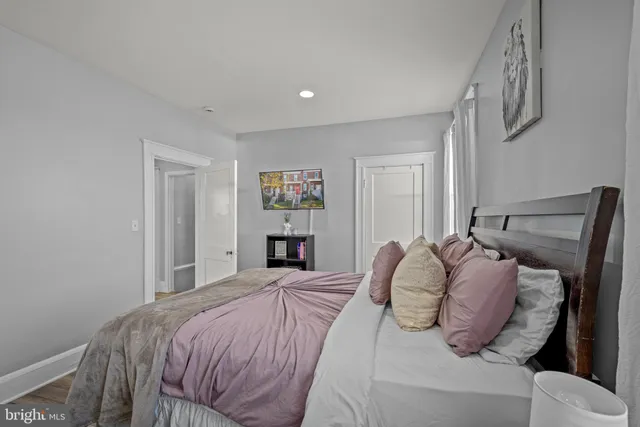 a bedroom with a bed and a lamp