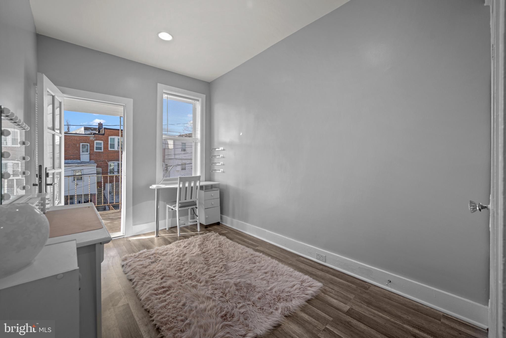3009 Kentucky Avenue Baltimore, MD 21213 - Photo 22 of 42 a living room with furniture and a table