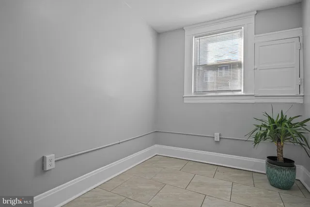 a view of a room that has a potted plant on the wall