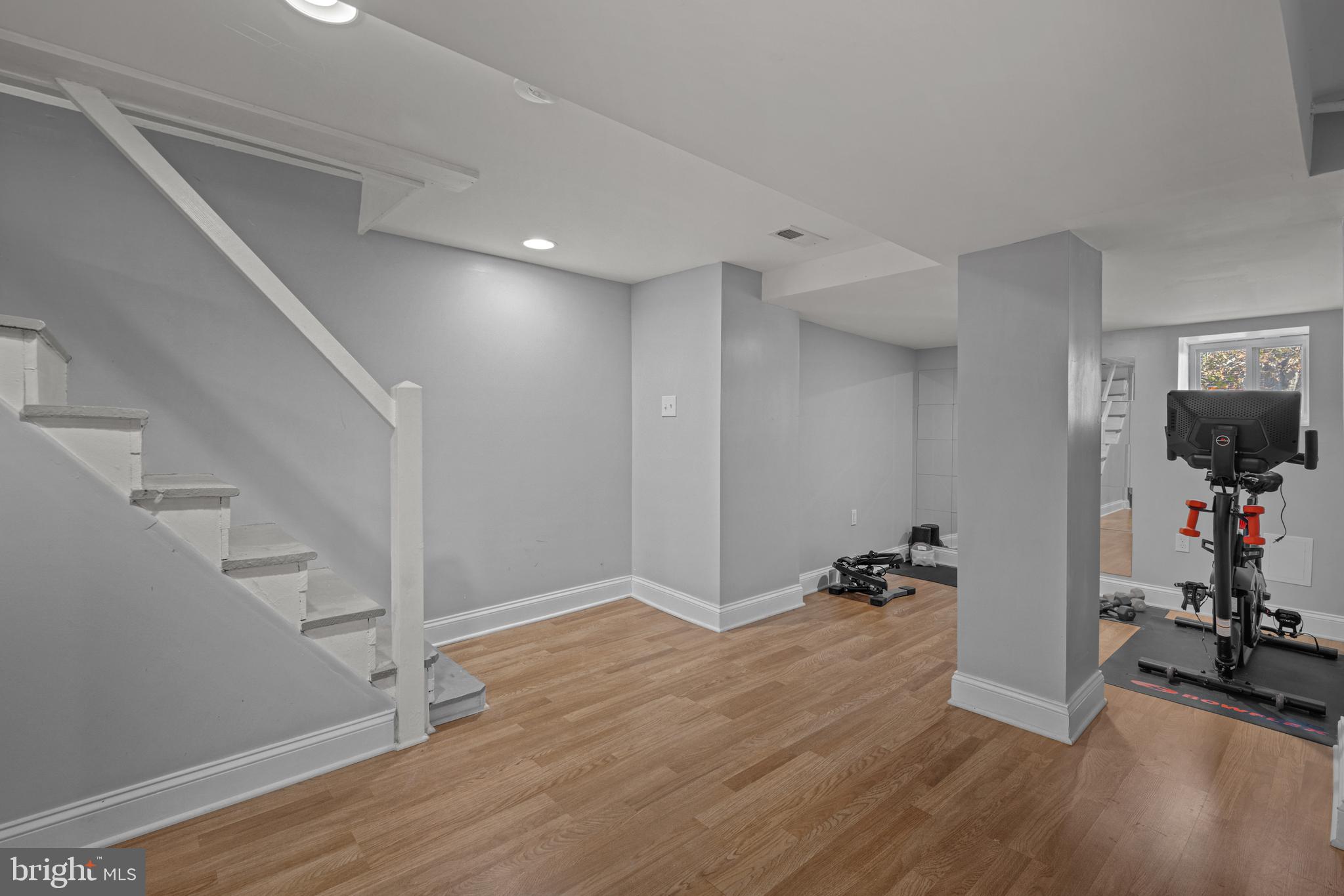 3009 Kentucky Avenue Baltimore, MD 21213 - Photo 28 of 42 a view of a room with wooden floor and stairs