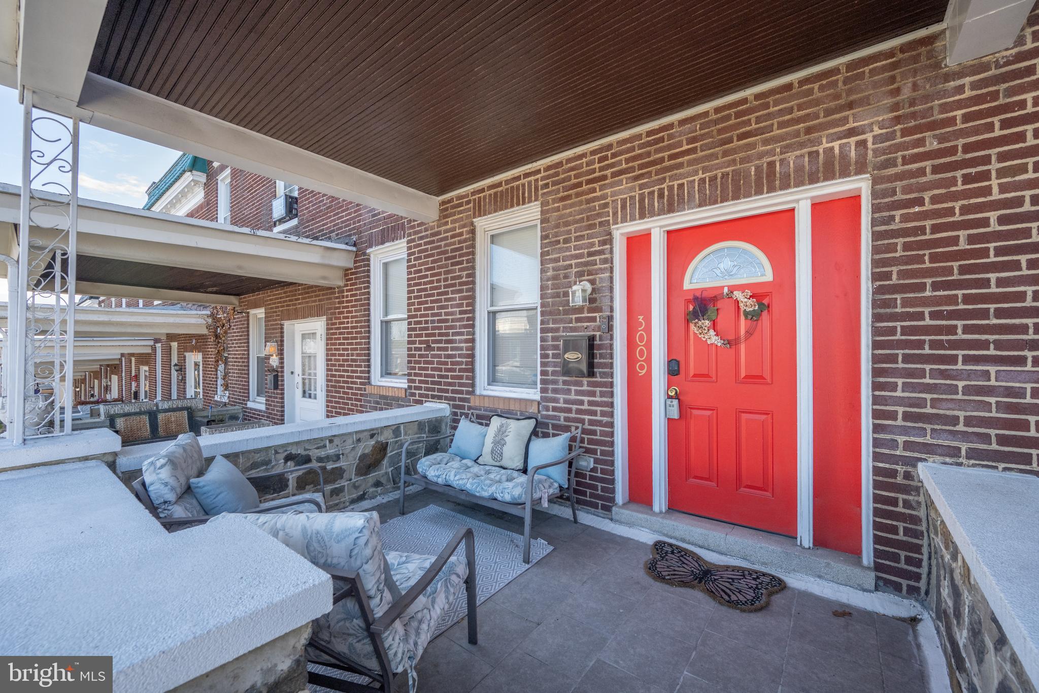 3009 Kentucky Avenue Baltimore, MD 21213 - Photo 3 of 42 a living room with furniture and a window