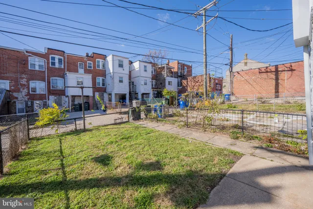 a swimming pool with outdoor seating and yard