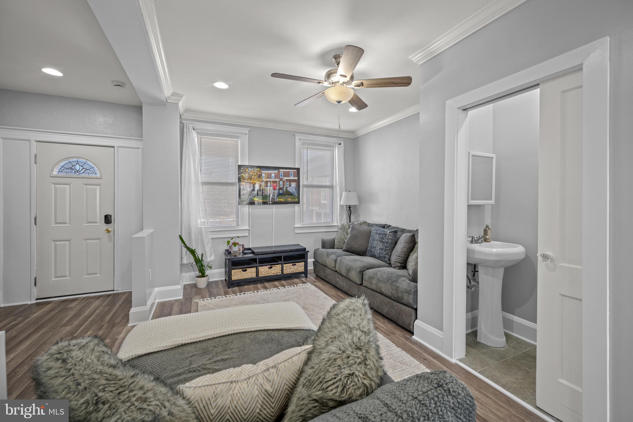 3009 Kentucky Avenue Baltimore, MD 21213 - Photo 5 of 42 a living room with furniture and a chandelier