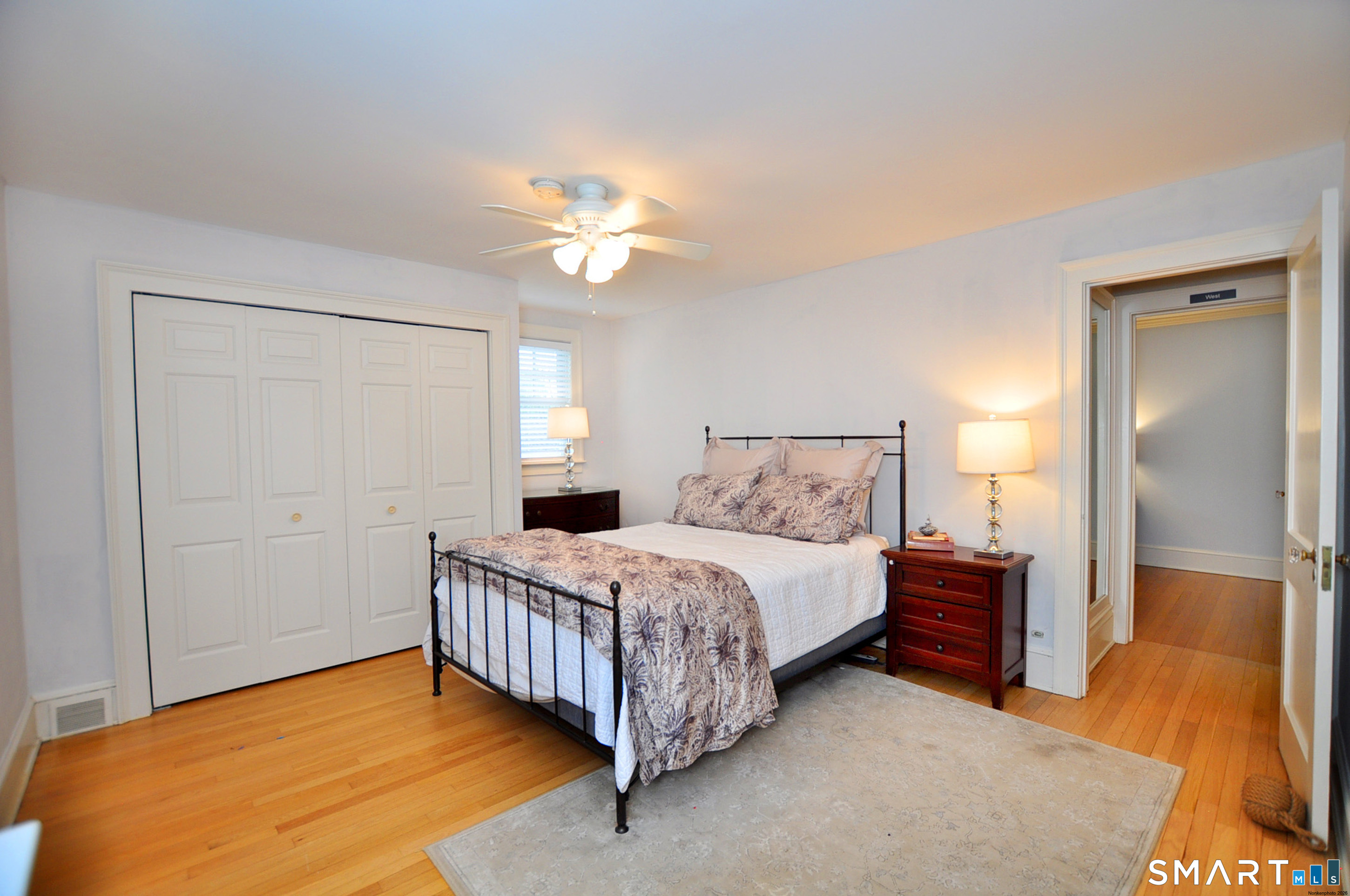 371 North Main Street Suffield, CT 06078 - Photo 30 of 39 a bedroom with a bed and a chandelier