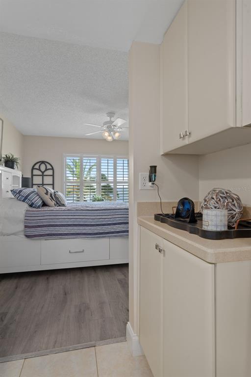 4550 Bay Boulevard, Unit 1211 Port Richey, FL 34668 - Photo 29 of 65 a kitchen with counter top space cabinets and outdoor space