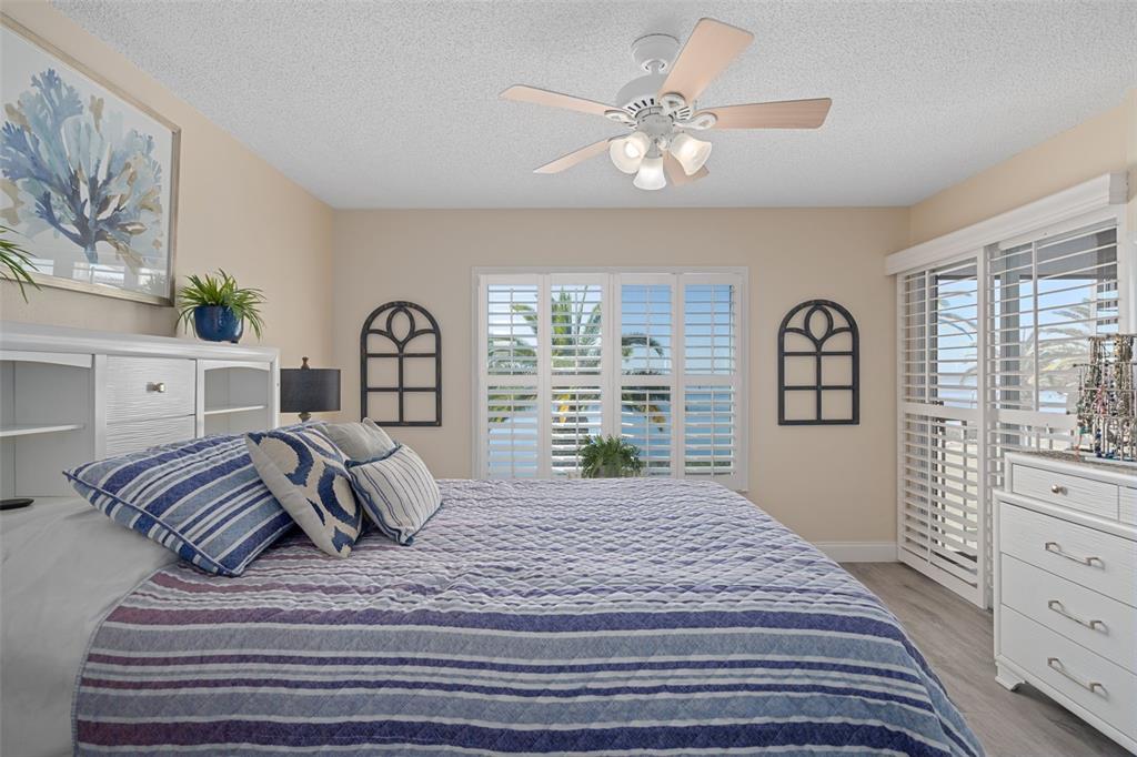 4550 Bay Boulevard, Unit 1211 Port Richey, FL 34668 - Photo 30 of 65 a bedroom with a bed and a dresser