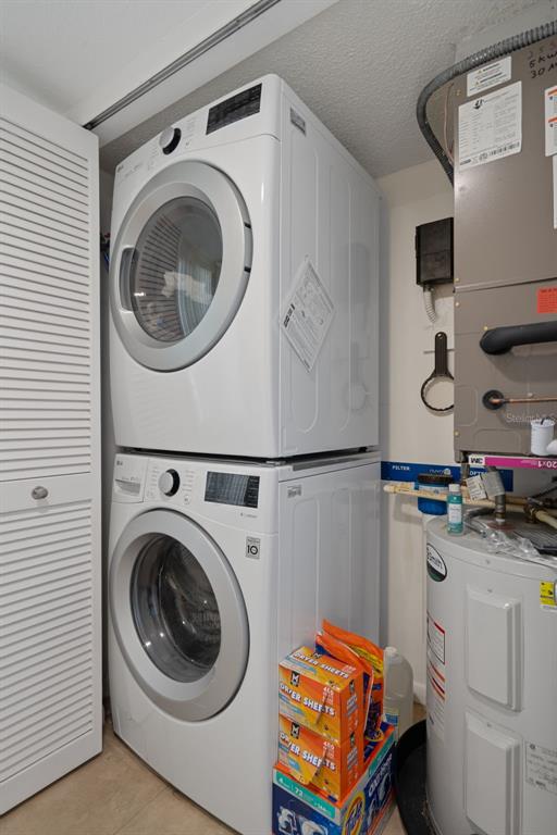 4550 Bay Boulevard, Unit 1211 Port Richey, FL 34668 - Photo 35 of 65 a utility room with dryer and washer