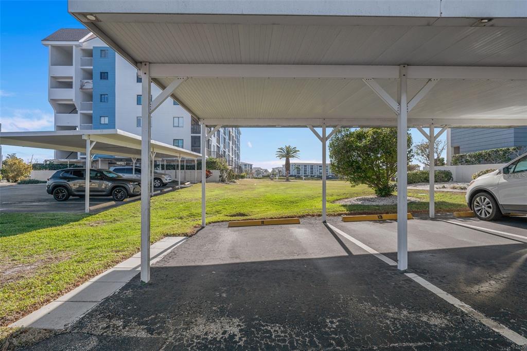 4550 Bay Boulevard, Unit 1211 Port Richey, FL 34668 - Photo 37 of 65 a view of a house with a backyard and a patio
