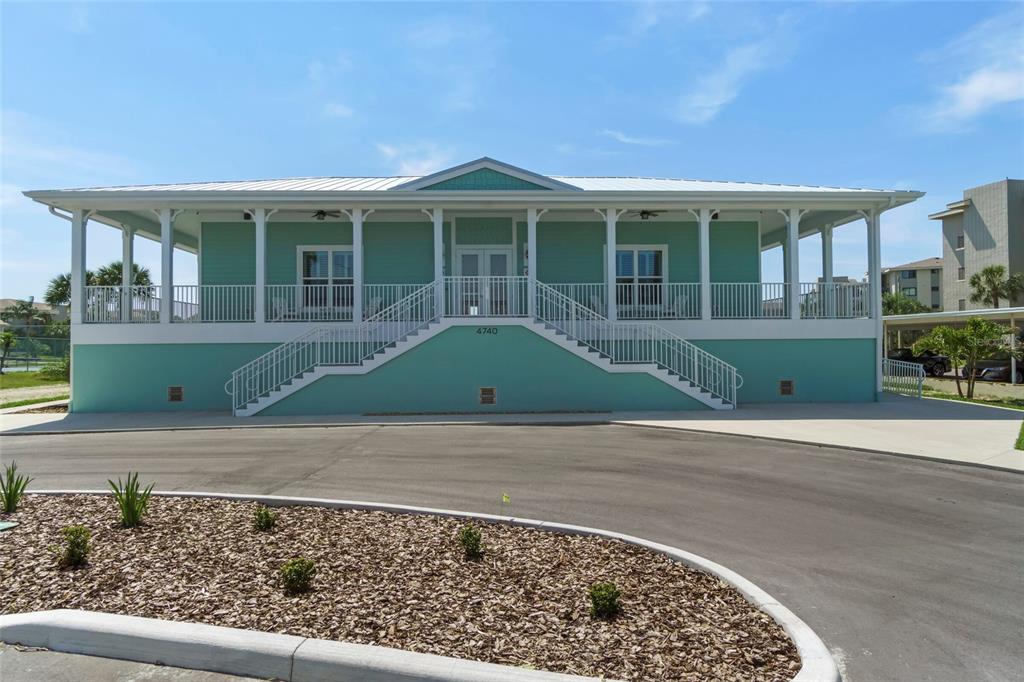 4550 Bay Boulevard, Unit 1211 Port Richey, FL 34668 - Photo 45 of 65 front view of a house with a porch