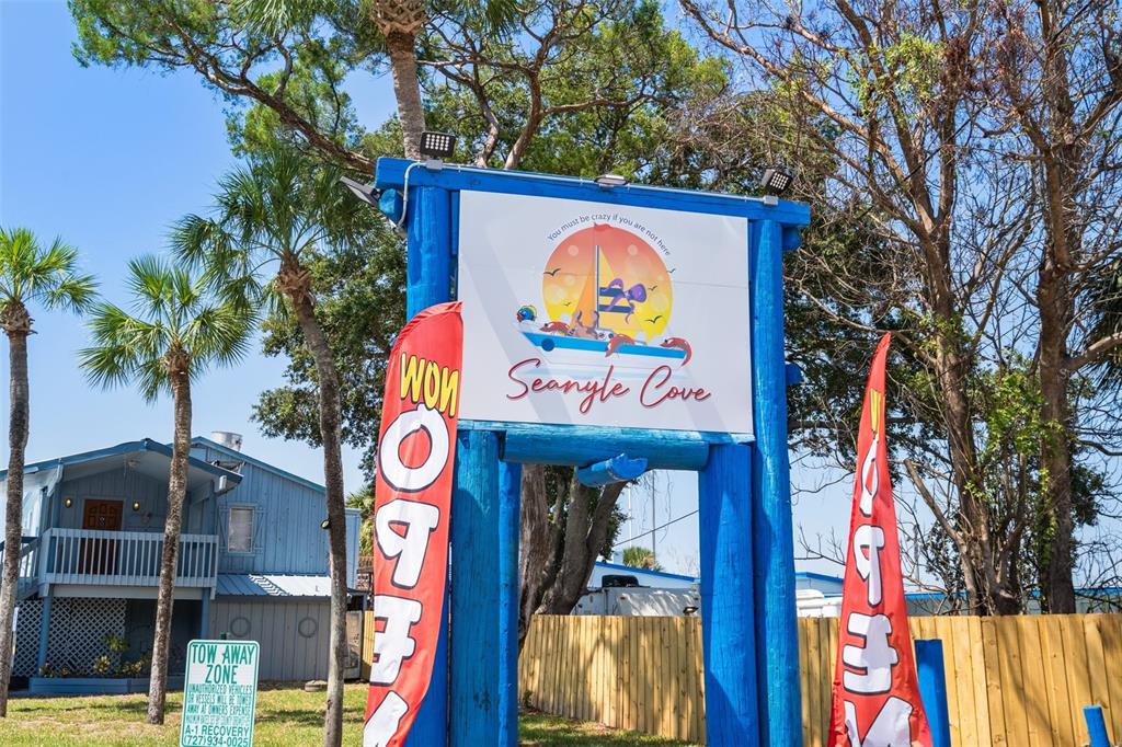 4550 Bay Boulevard, Unit 1211 Port Richey, FL 34668 - Photo 61 of 65 a sign that is on the wall of a building