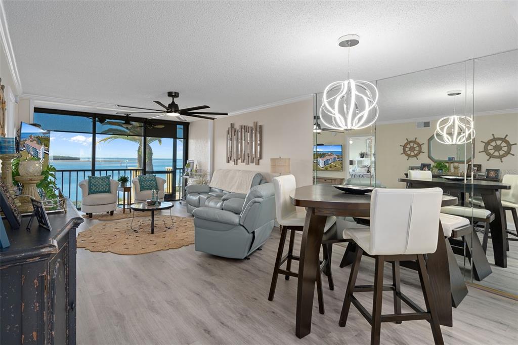 4550 Bay Boulevard, Unit 1211 Port Richey, FL 34668 - Photo 7 of 65 a view of a dining room with furniture window and wooden floor
